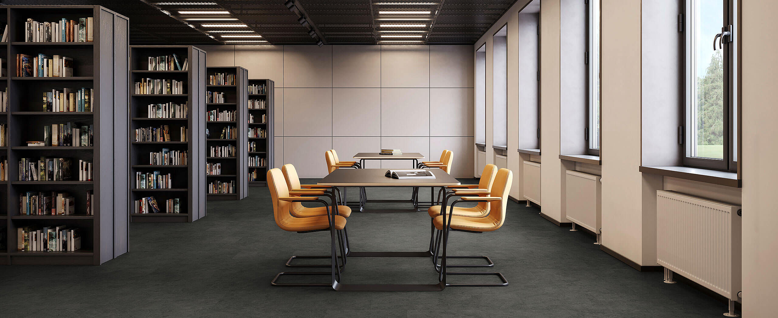Library room with shelves and tables, yellow chairs on recycled elastic flooring in a dark grey stone-look design.