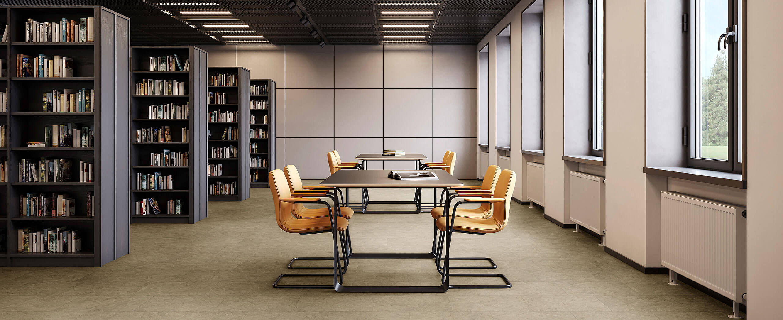 Library room with shelves and tables, yellow chairs on recycled elastic flooring in a light sand-stone look.
